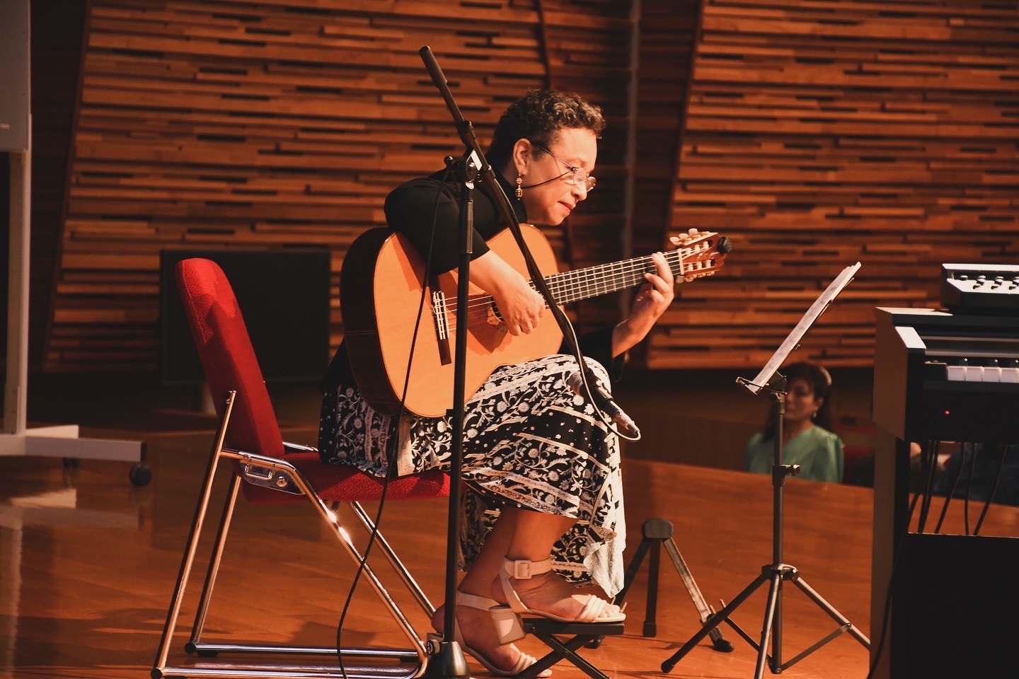 Vilma playing classical guitar