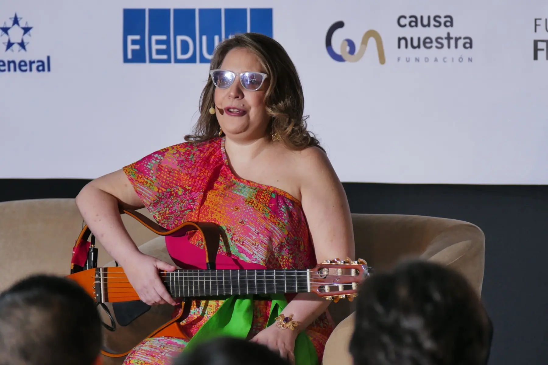 Vilma Esquivel with a guitar during a performance